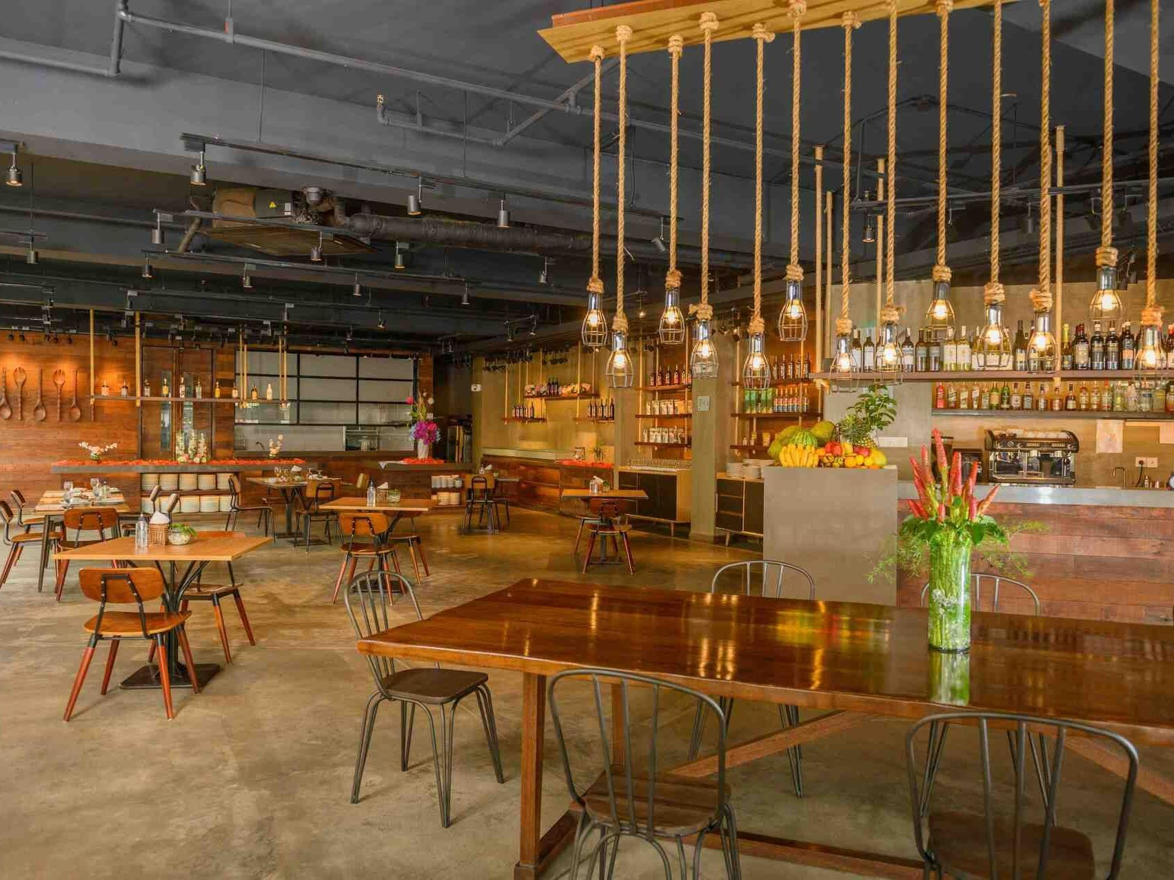 Industrial-chic dining area at LA-UD restaurant, Hue Hotel Puerto Princesa