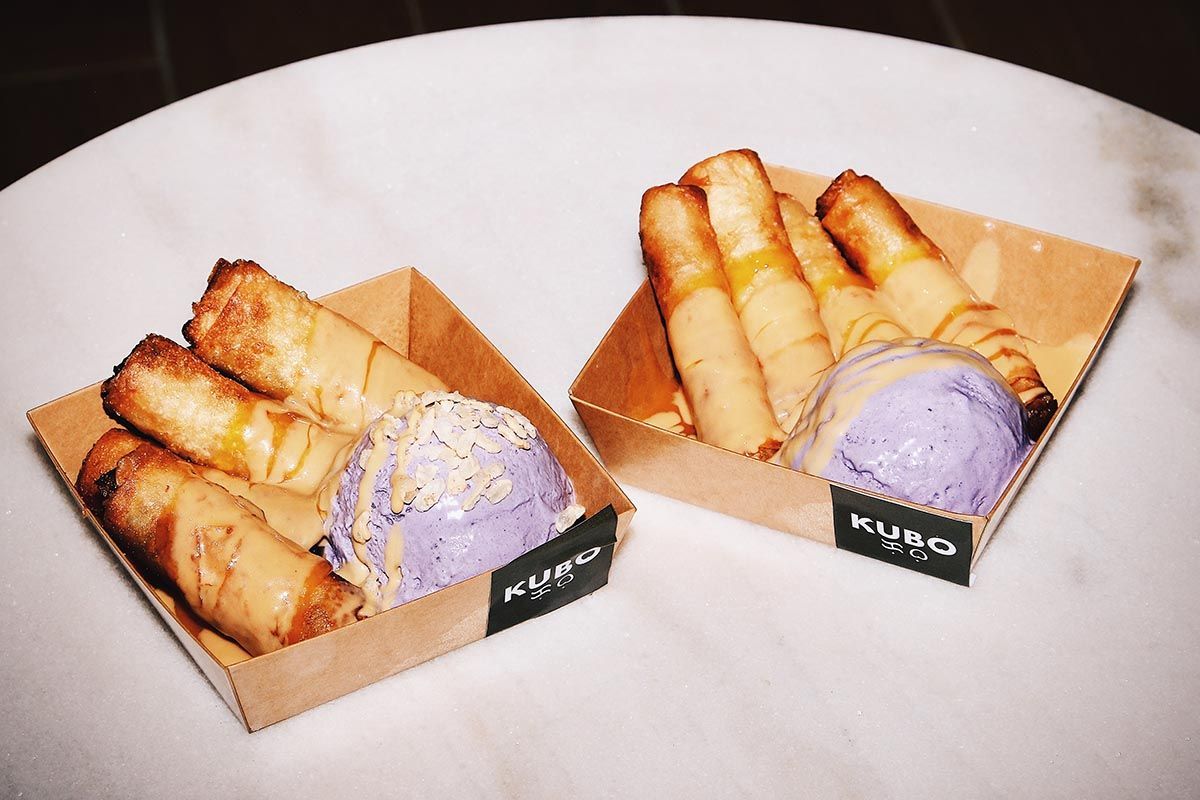 Purple ube ice cream served with crispy spring rolls in Kubo branded takeout boxes, a family favorite in Hue Hotel Boracay