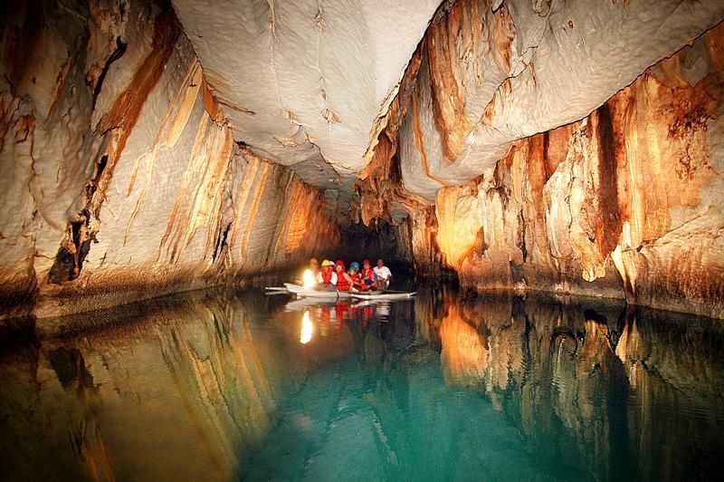 Tourists boating through Puerto Princesa Underground River cave, Palawan
