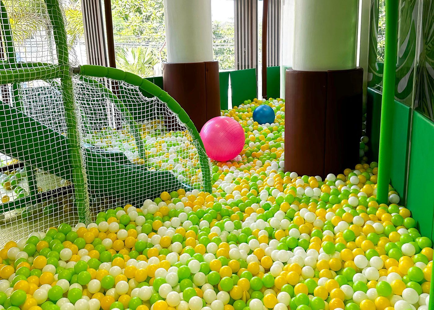 Indoor ball pit with green, yellow, white balls at Hue Hotel Boracay