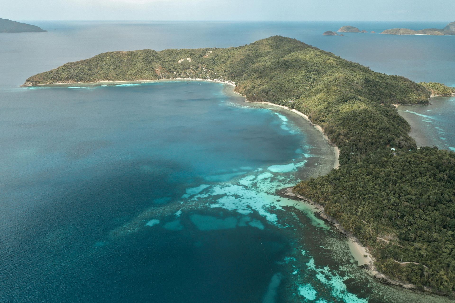 Aerial view of tropical island with coral reefs near Puerto Princesa Palawa