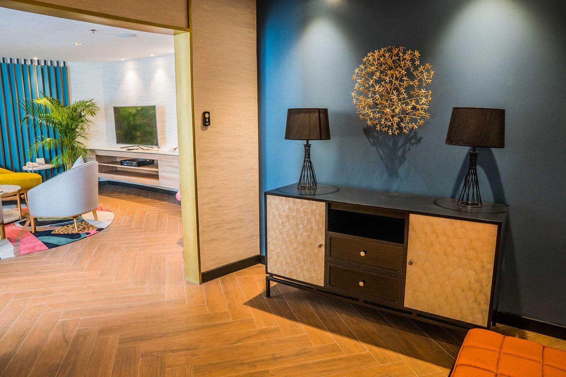 Stylish hotel suite entryway with herringbone floors at Hue Hotel Boracay