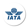 IATA logo: blue wings with a globe, blue text “IATA”, on a white circle.