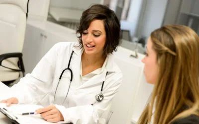 A doctor is talking to a patient in a hospital.