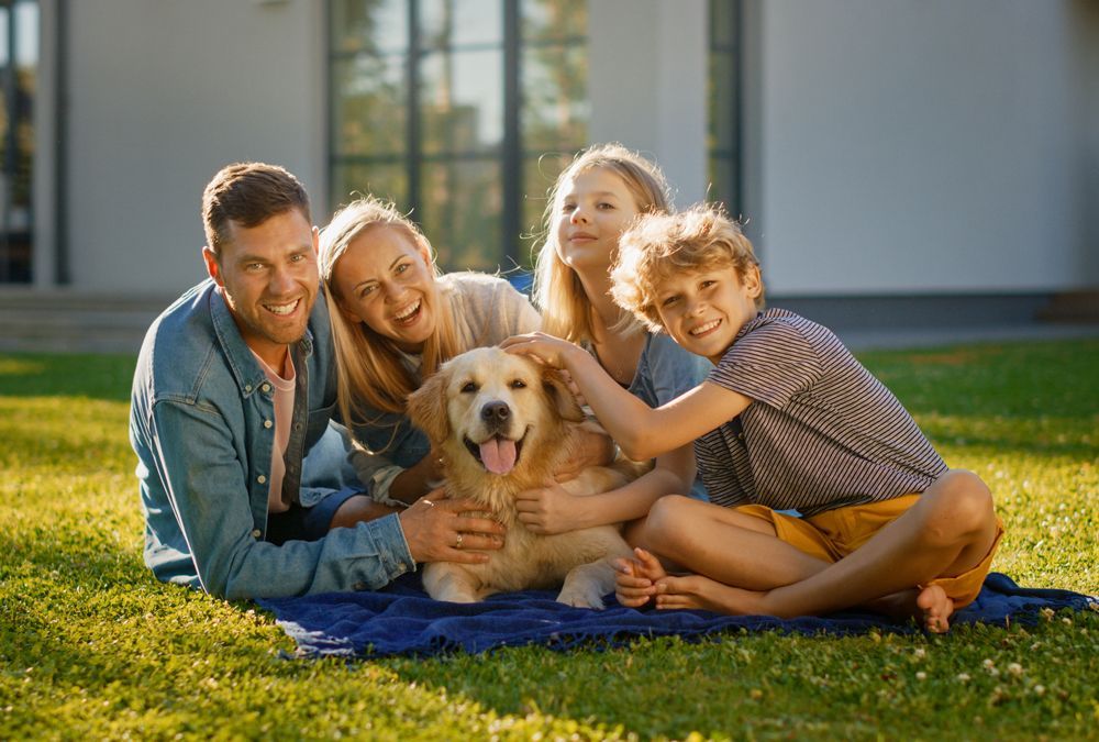 Family with Dog — Currumbin, QLD — Currumbin Vet Surgery Family with Dog — Currumbin, QLD — Currumbin Vet Surgery