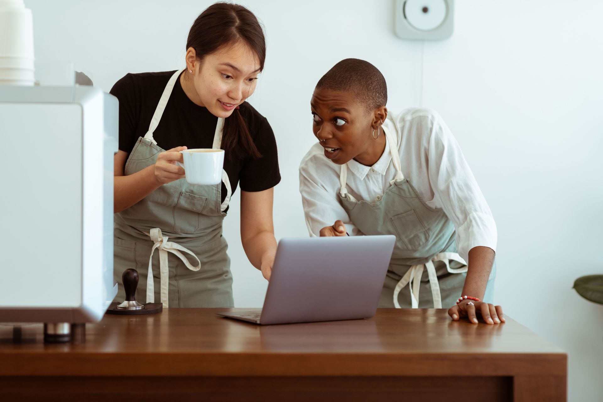 Small team working together around a laptop