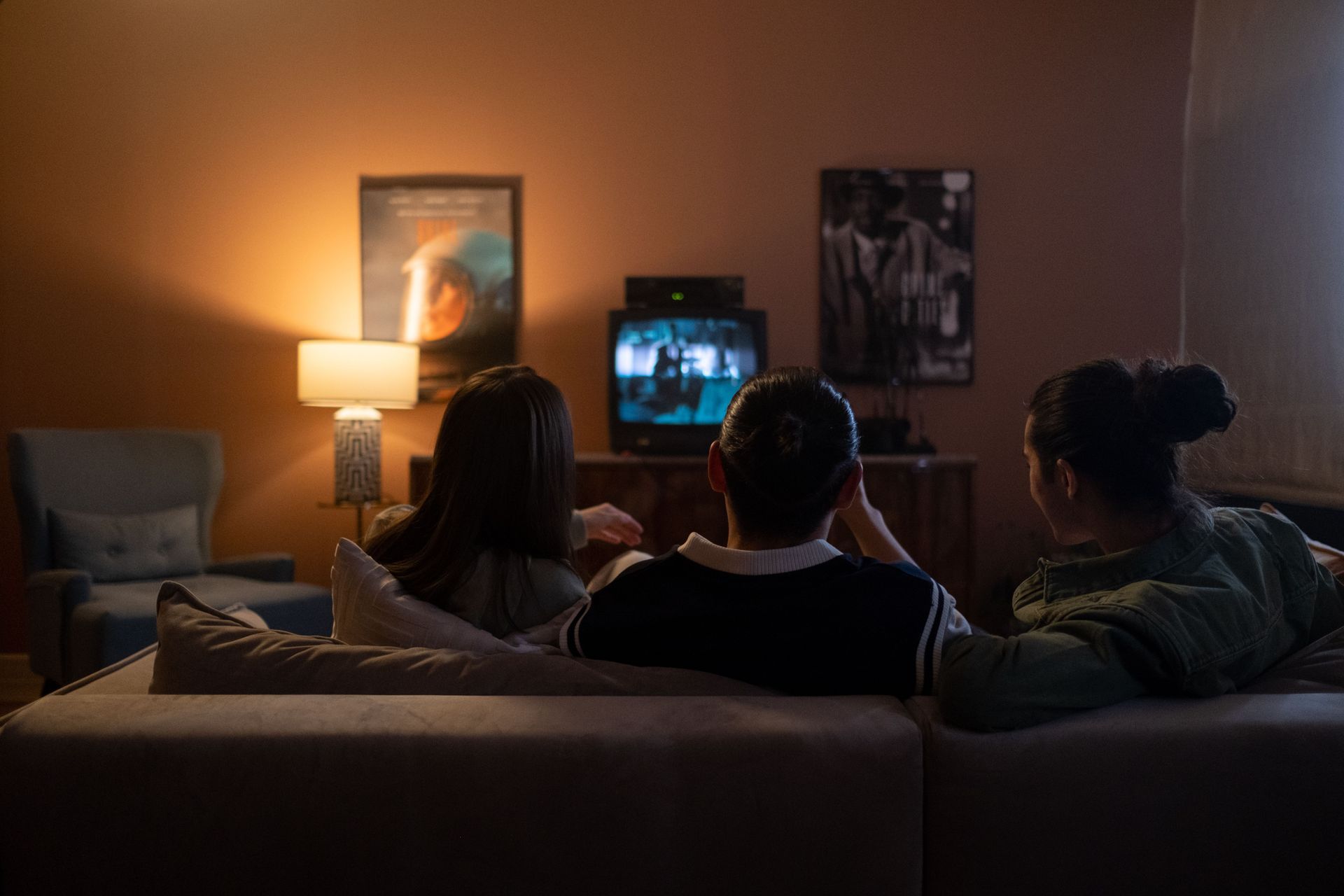 Family watching TV together in the living room