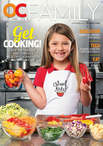 A little girl is on the cover of oc family magazine