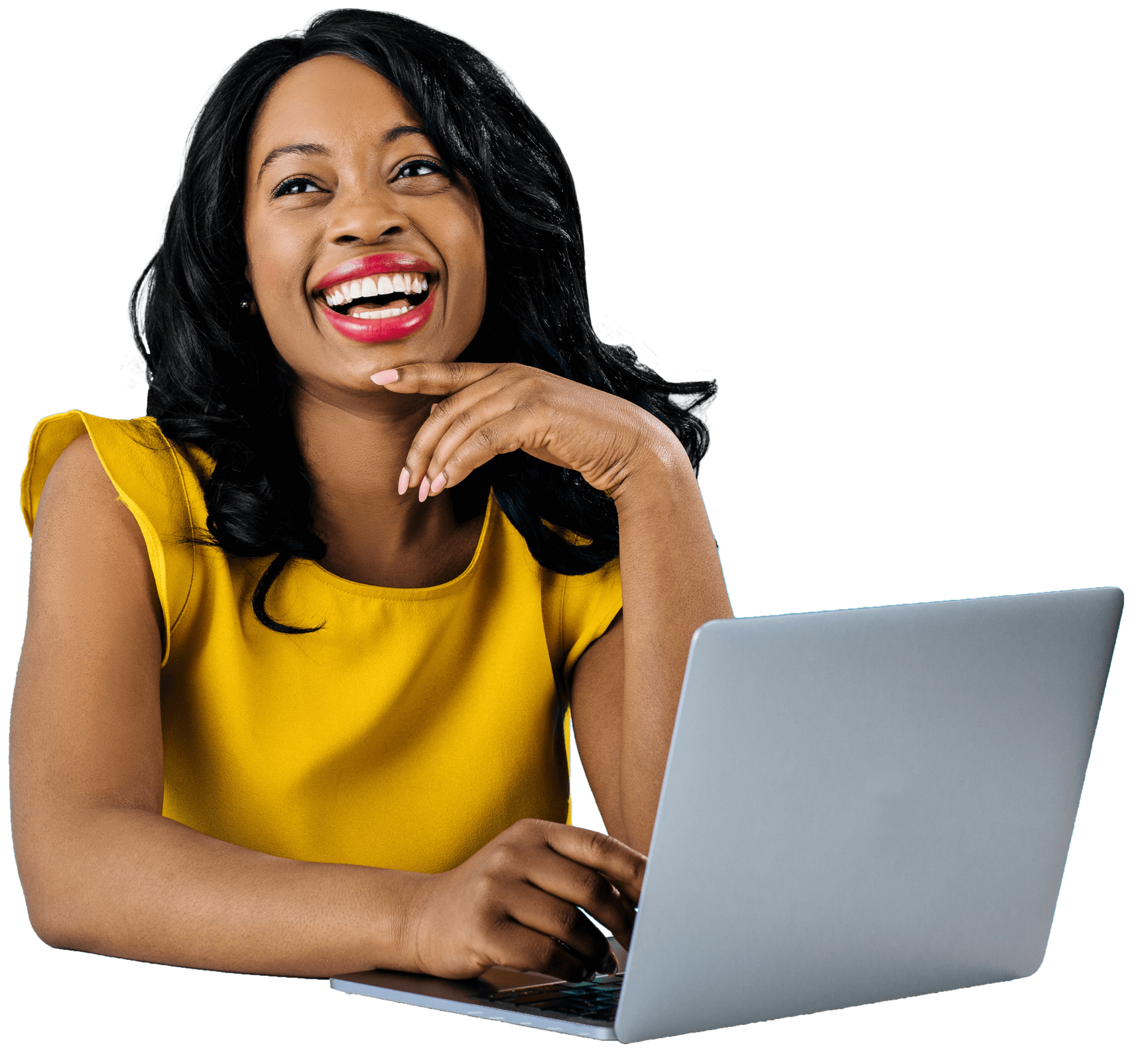 Smiling woman in a yellow top using a laptop on a white background