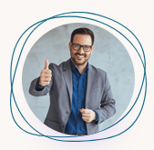 Smiling man in a gray blazer giving a thumbs-up inside a blue circular frame
