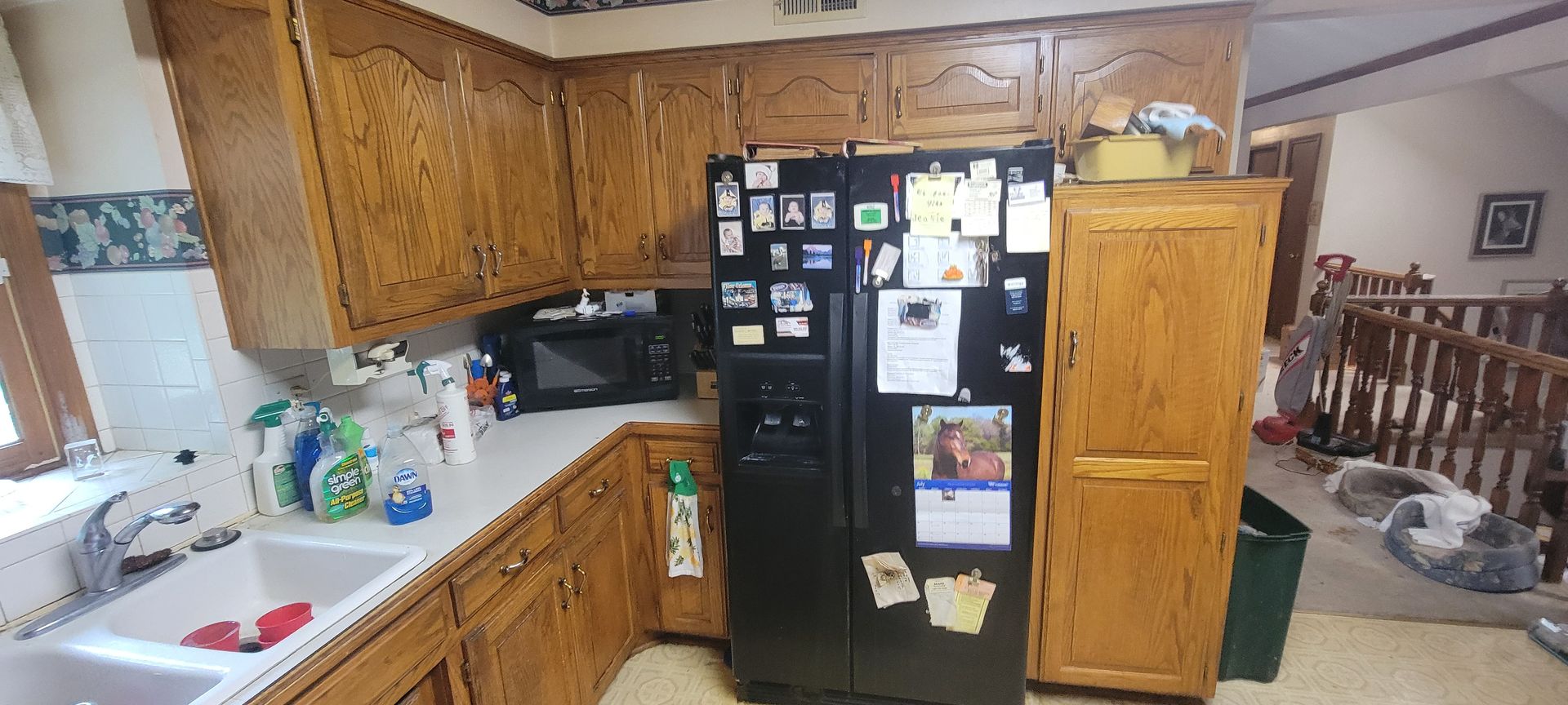 a kitchen in a A house for sale that is cluttered