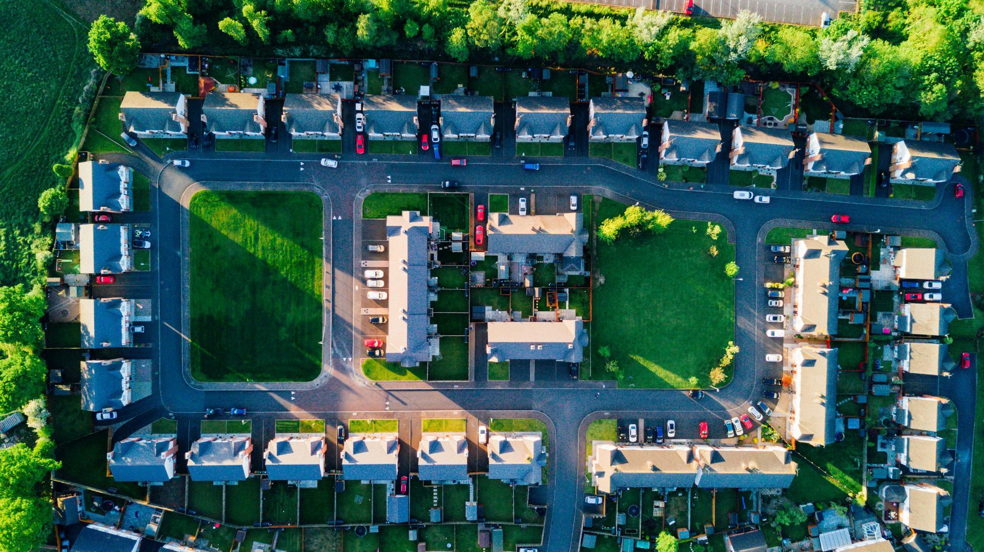 An aerial view of a residential area with lots of houses and trees.