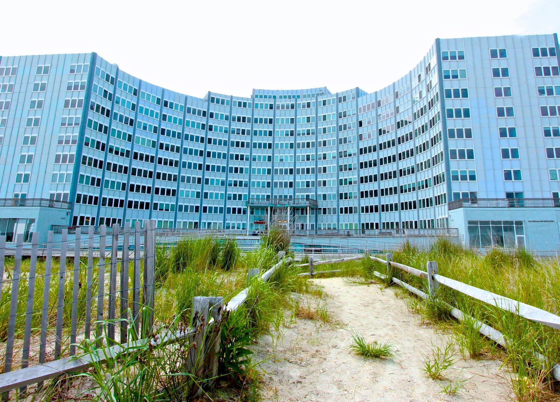 A large building with a fence in front of it