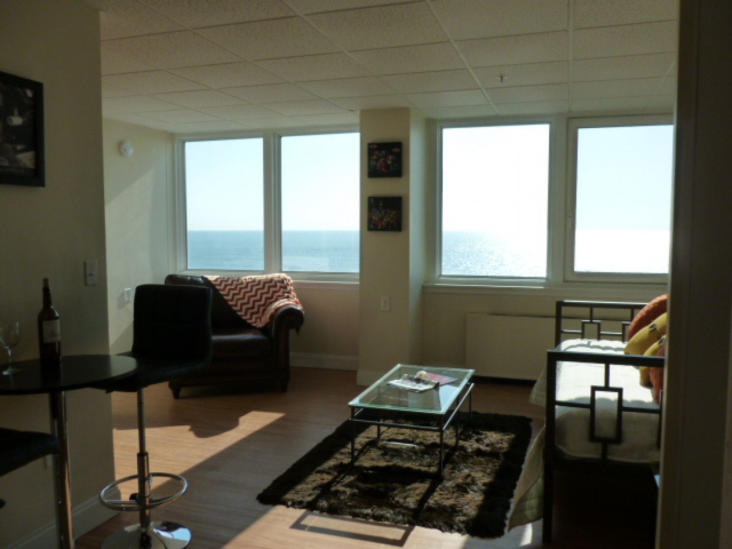 A living room with a view of the ocean