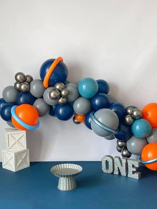 A balloon garland with the word one on it. A balloon garland with the word one on it.