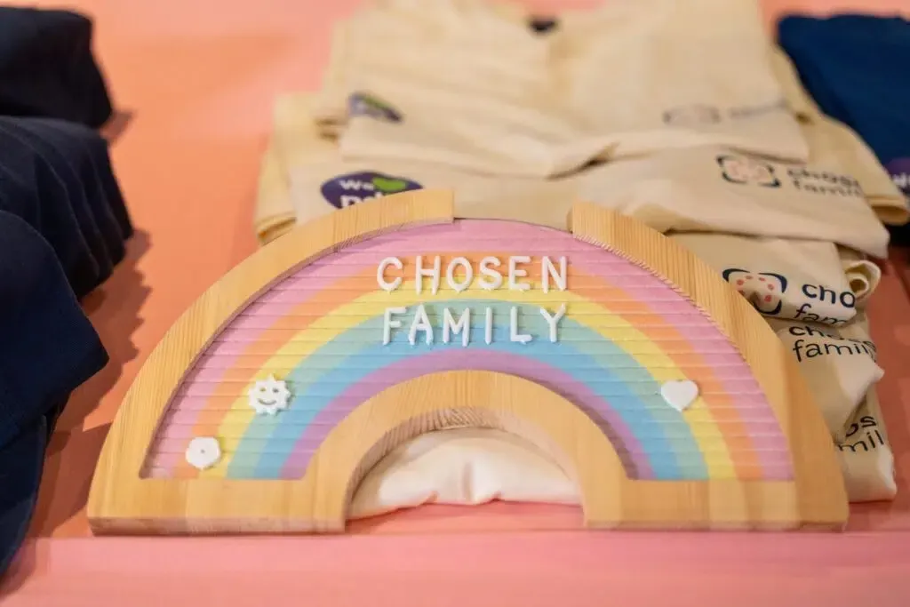 Wooden rainbow sign with 