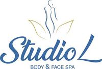 Logo for Studio L Body & Face Spa. Blue script lettering with silhouette of a woman above text and gold leaf design.