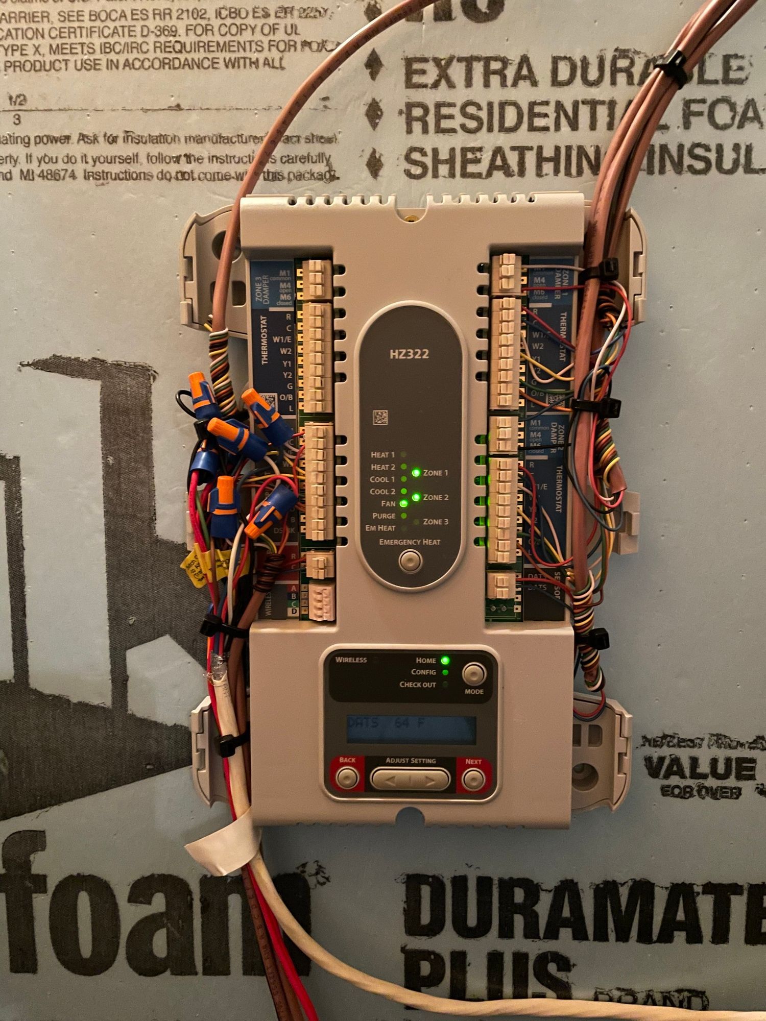 A device is mounted on a foam board that says duramate plus