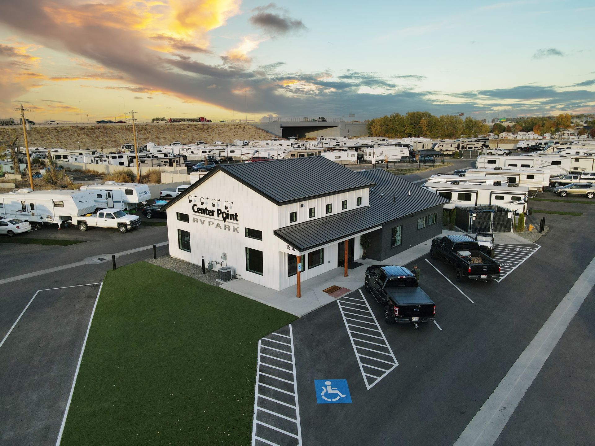 Center Point RV Park at sunset with a white club house in Caldwell, Idaho.