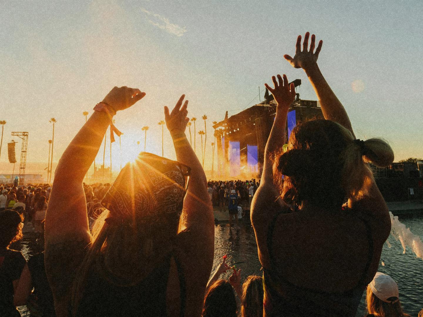Festival goers enjoying the sunset after an epic day.
