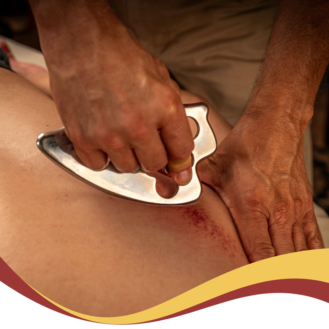 A person is getting a massage with a stainless steel tool