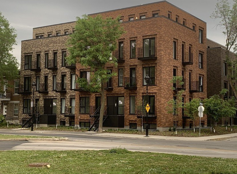 A large brick building with a fire escape on the side of it