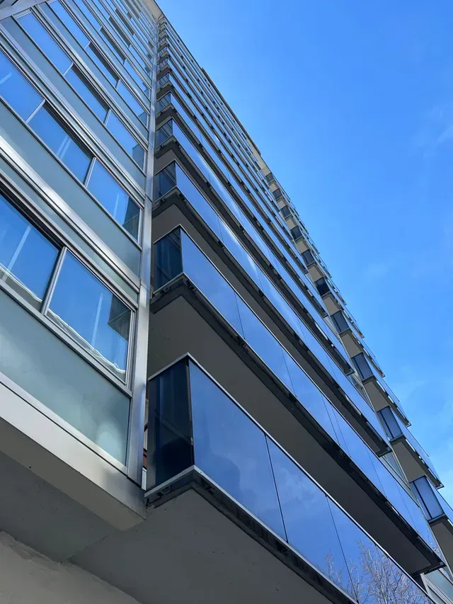 Looking up at a tall building with a lot of windows