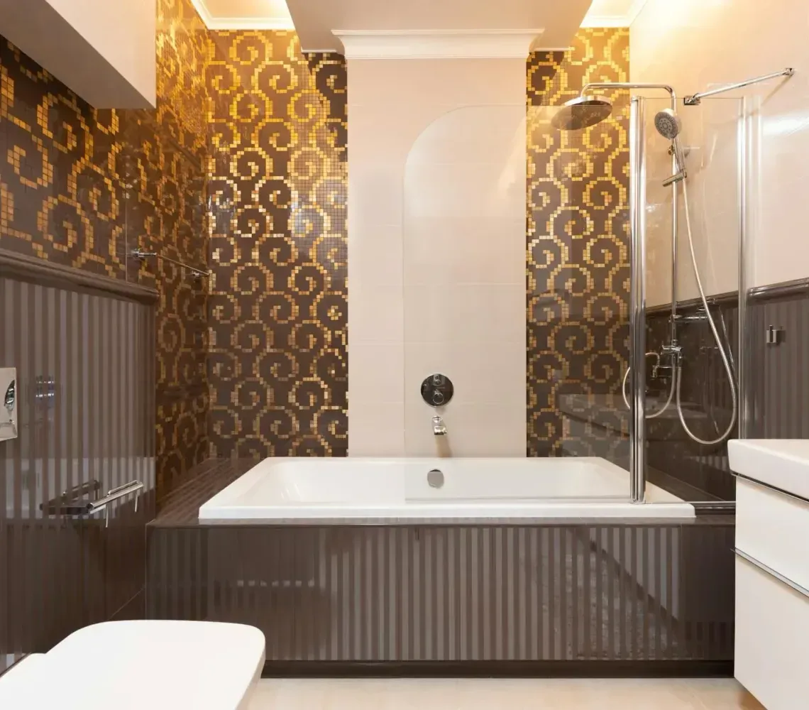 Modern bathroom with a bathtub, shower, white vanity, and brown patterned wallpaper
