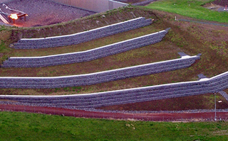 An Aerial View Of A Hillside With A Row Of Stone Walls – Warrnambool, VIC - McKinnon Quarries & Civil