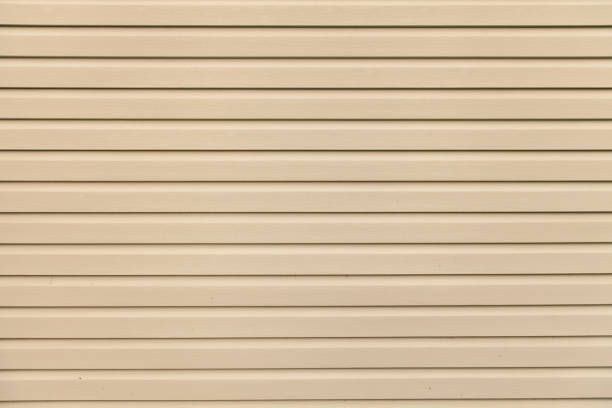 Tan horizontal siding.