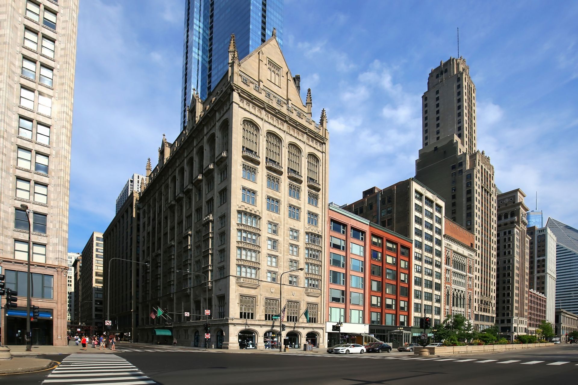 City street with historic and modern tall buildings on a sunny day