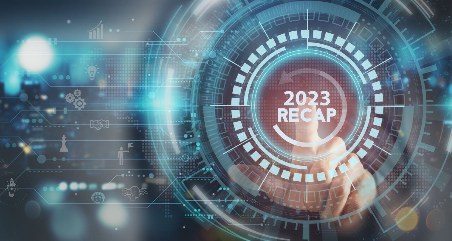 A person is pressing a button on a futuristic screen that says 2023 recap.