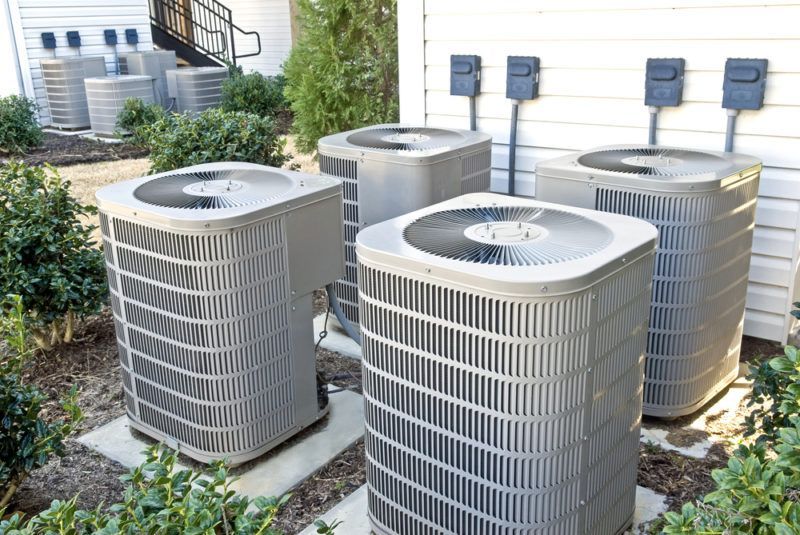 Several air conditioning units installed in backyard Several air conditioning units installed in backyard