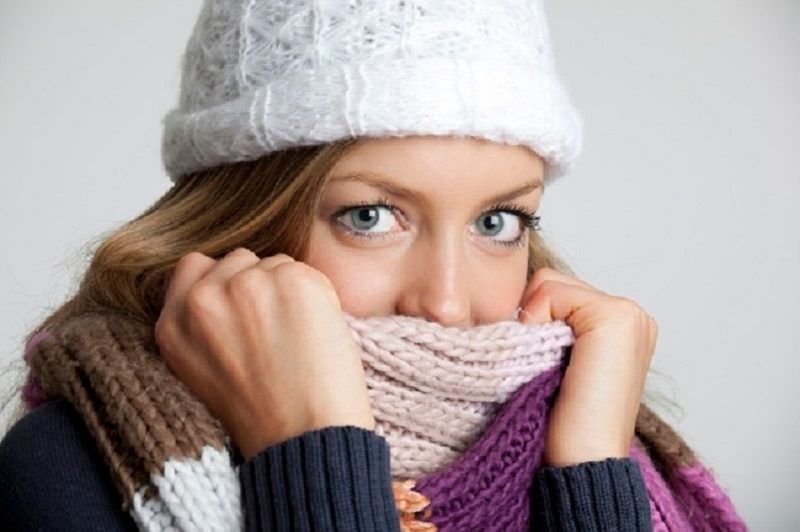 Woman wearing white hat and scarf