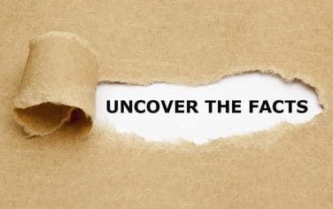 Torn paper reveals uncover the facts text Torn paper reveals uncover the facts text