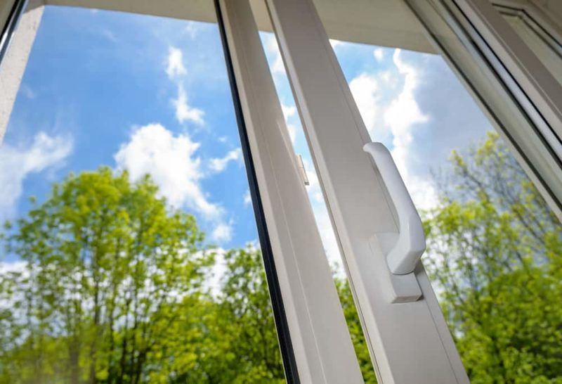 Window with white frame and handle Window with white frame and handle