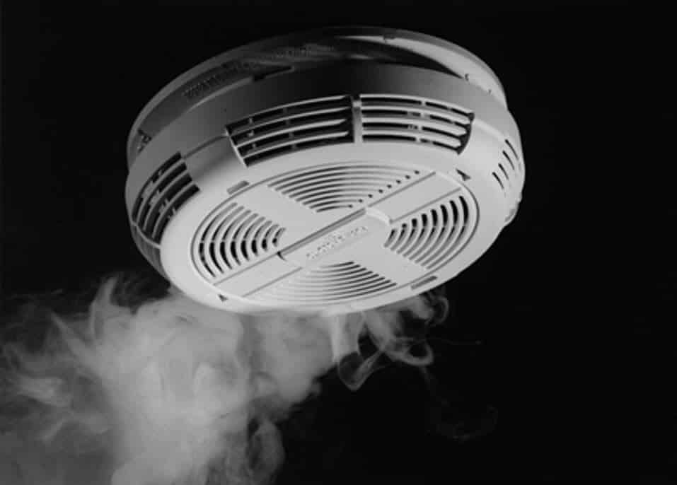 Smoke detector emitting smoke Smoke detector emitting smoke