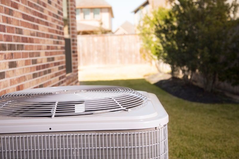 Air conditioning unit outside a brick building