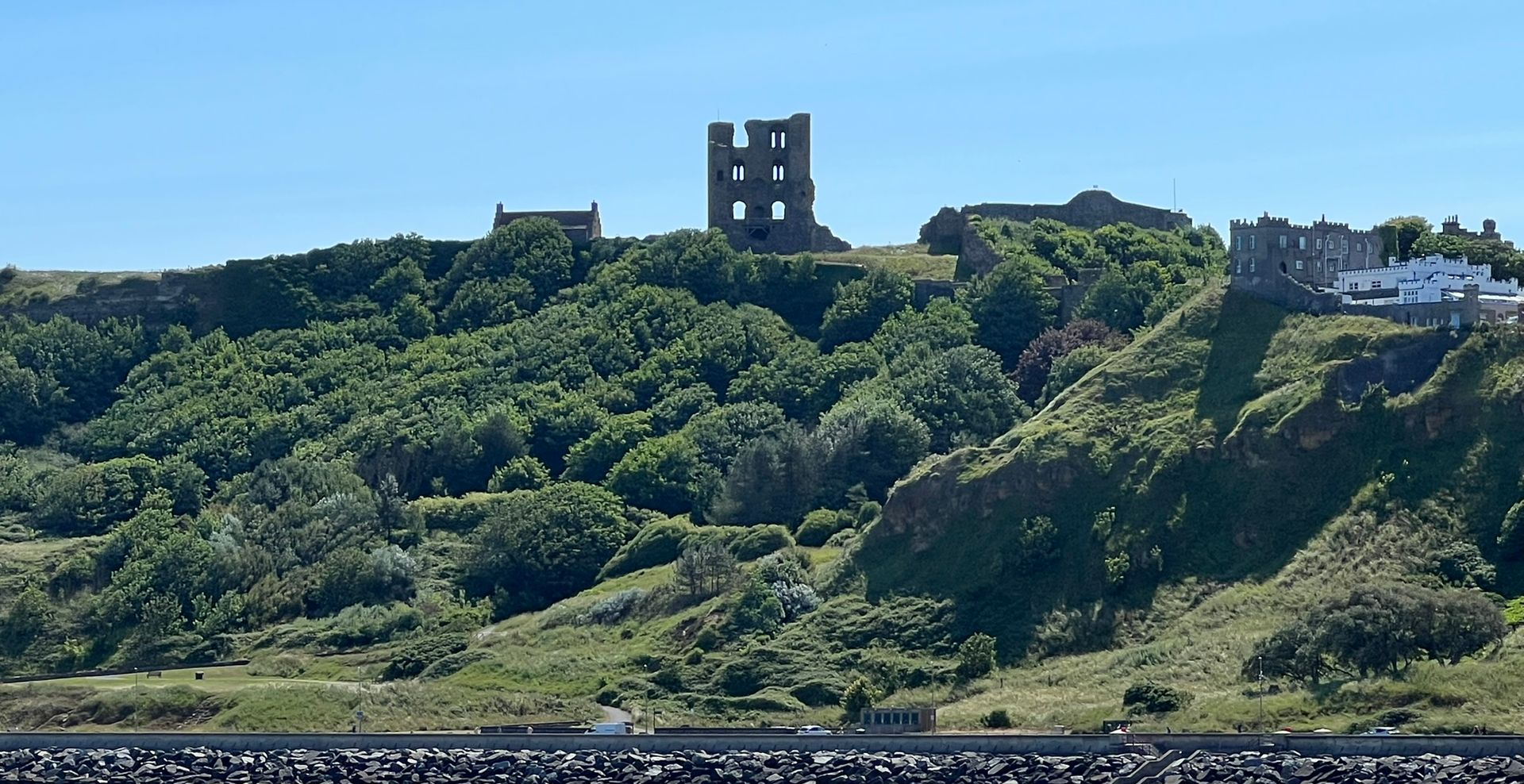 Scarborough Castle high above the coastline, viewed from North Bay.
