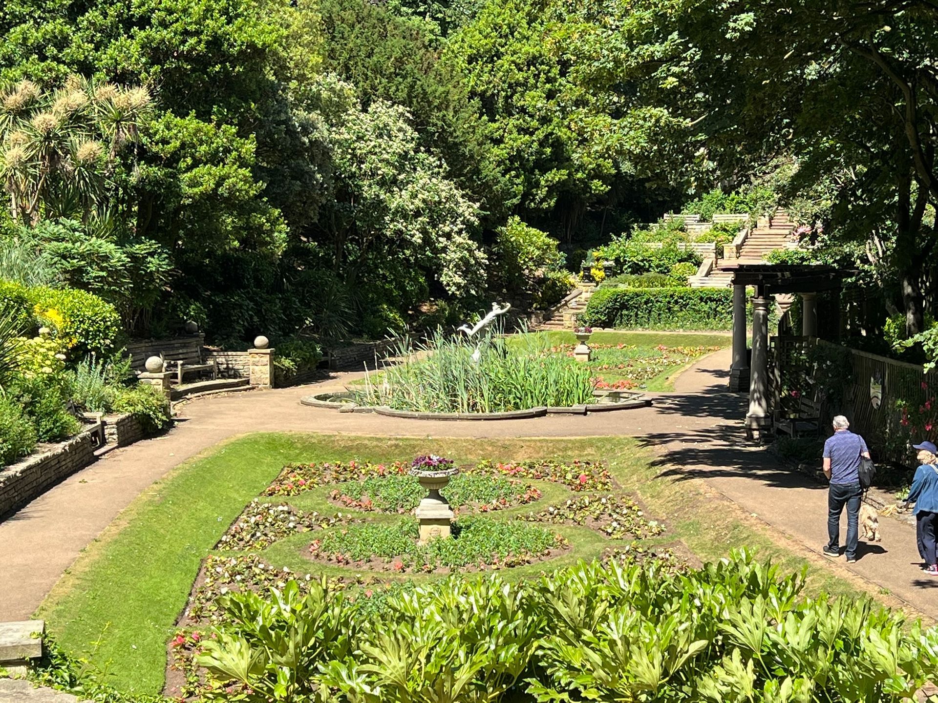 The iconic bronze statue of Mercury atop a stone fountain and lily pond in Scarborough’s historic South Cliff Italian Gardens.