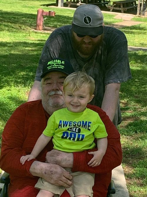 Founder Kenneth Walters at a family picnic with his son and great-grandson