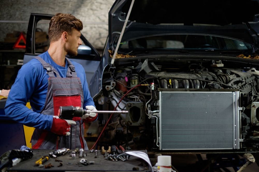 Two Men Are Standing Next to Each Other on A City Street — Steve Purse Automotive In Jervis Bay, NSW