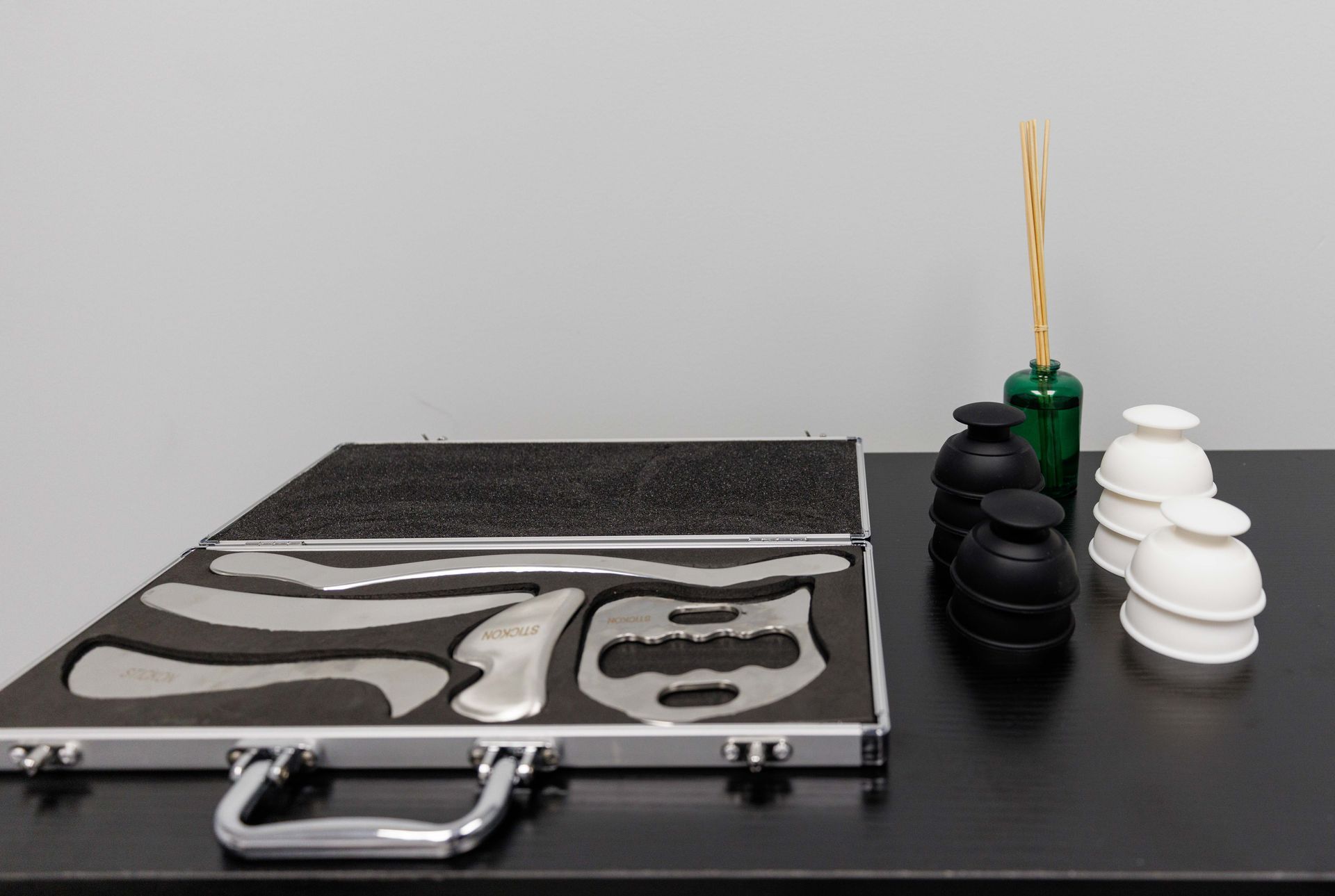 a briefcase filled with various objects is sitting on a table .