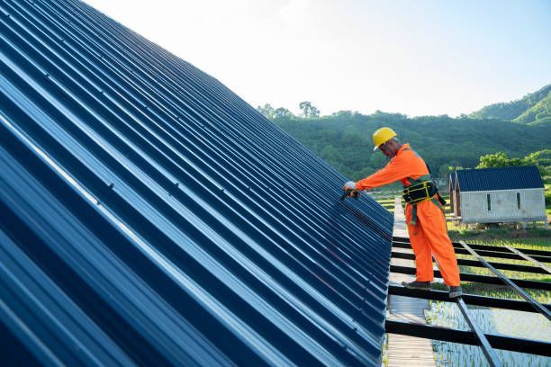 Man in uniform doing roof inspections