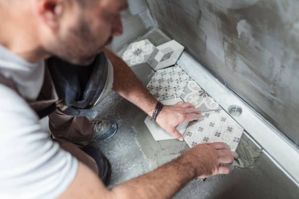 Installing tiles on the bathroom floor