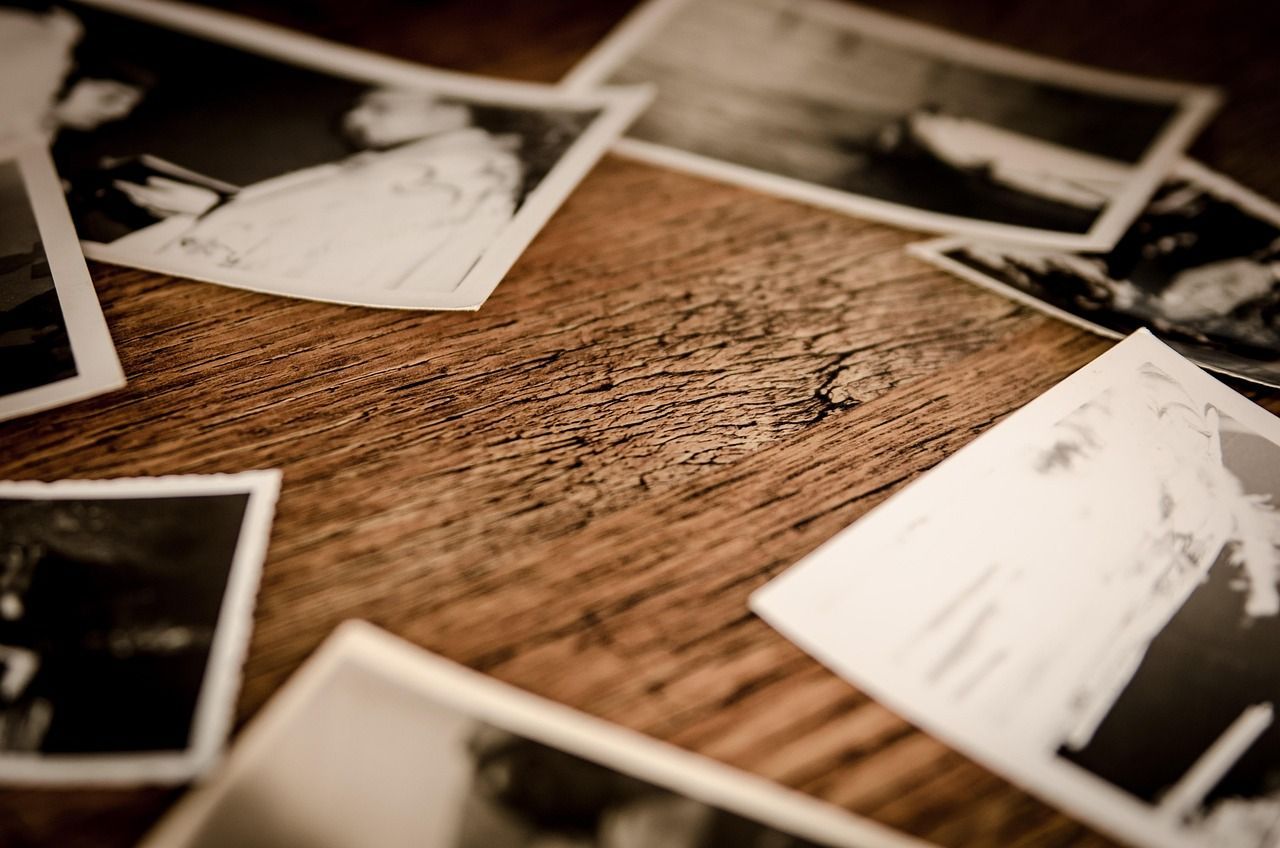Photo of a table, surrounded by polaroids
