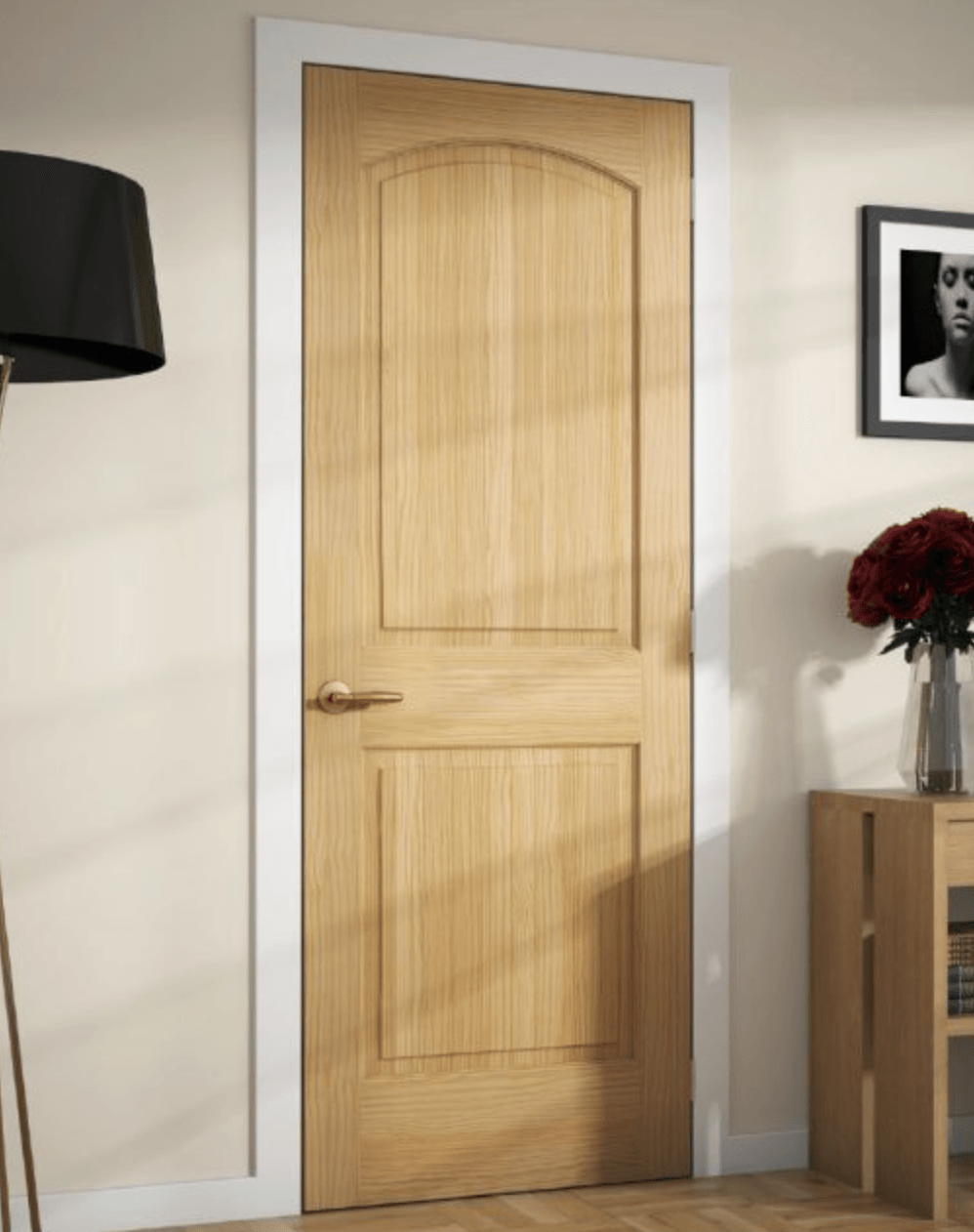 A wooden door in a room with a picture on the wall above it