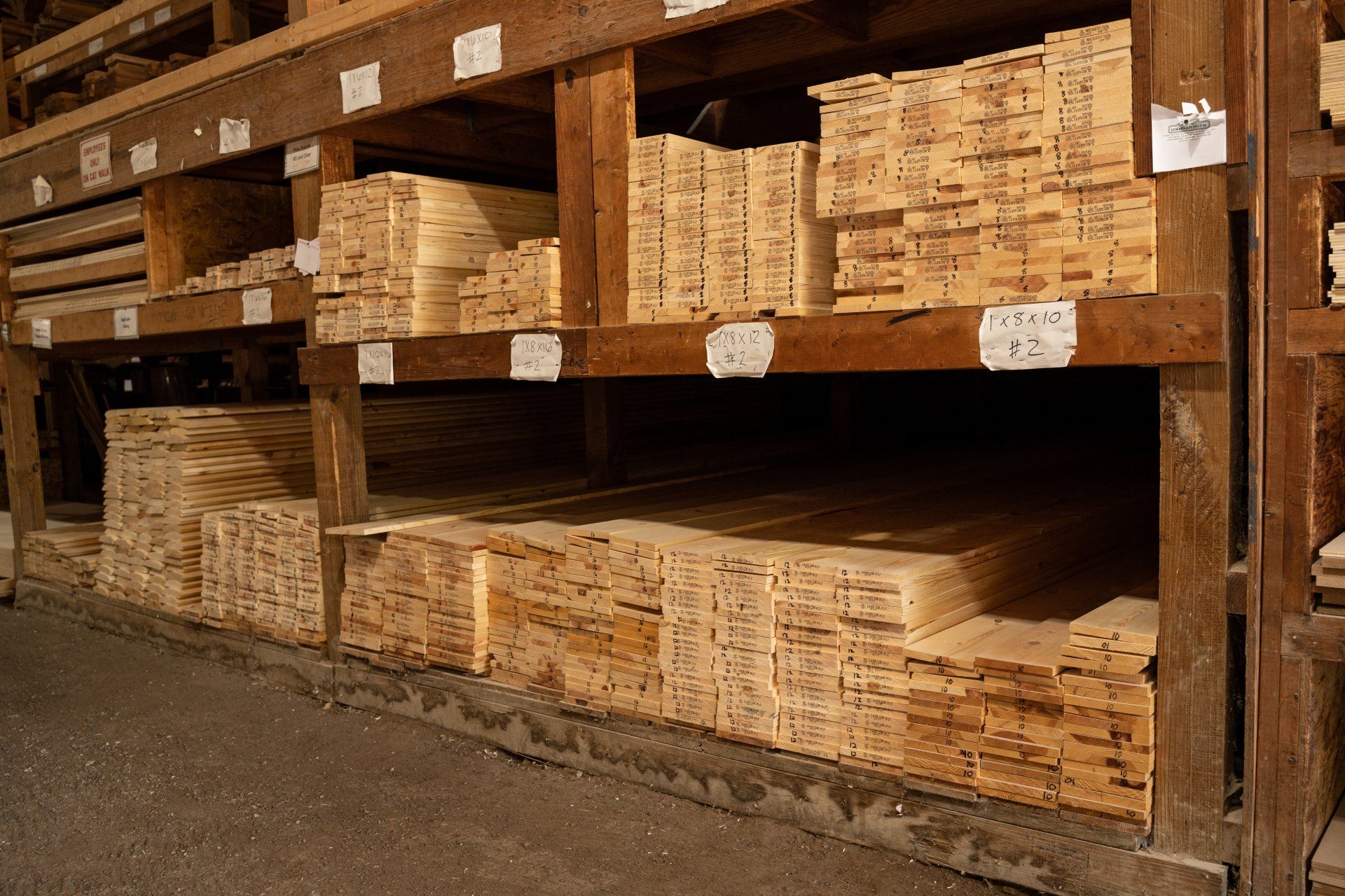 A warehouse filled with lots of wooden shelves