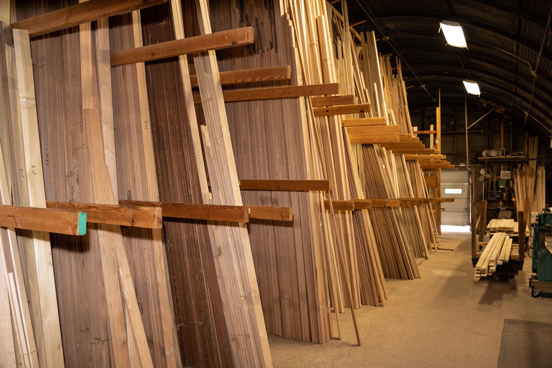 A warehouse filled with lots of wooden boards