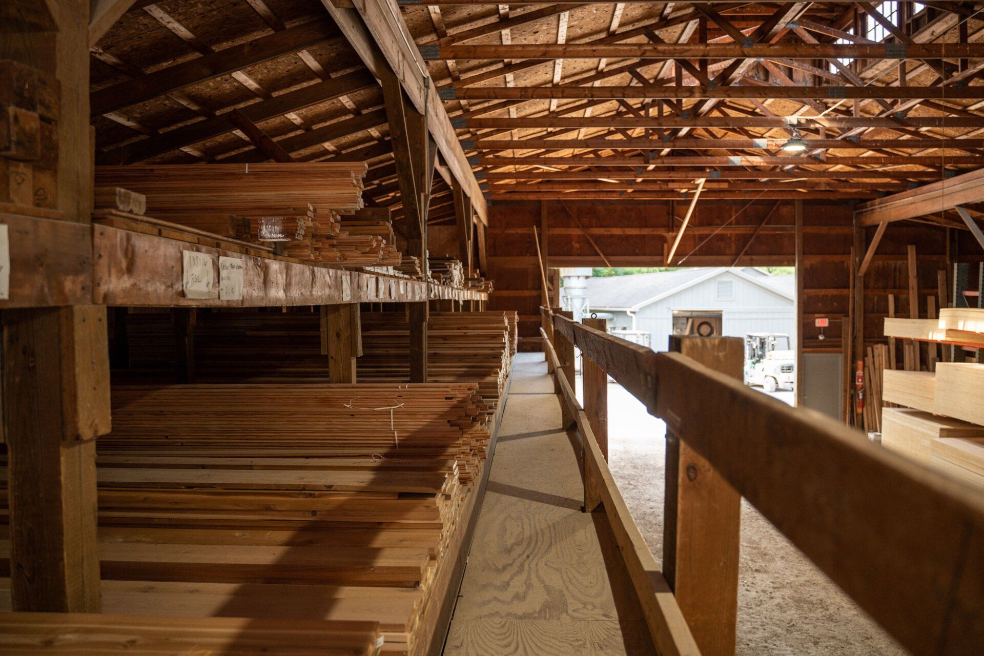 A warehouse filled with lots of wooden boards.